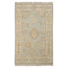 Rug & Kilim's Oushak Style Rug in Blue with Beige-Brown Floral Patterns (tapis de style Oushak en bleu avec des motifs floraux beige et marron)