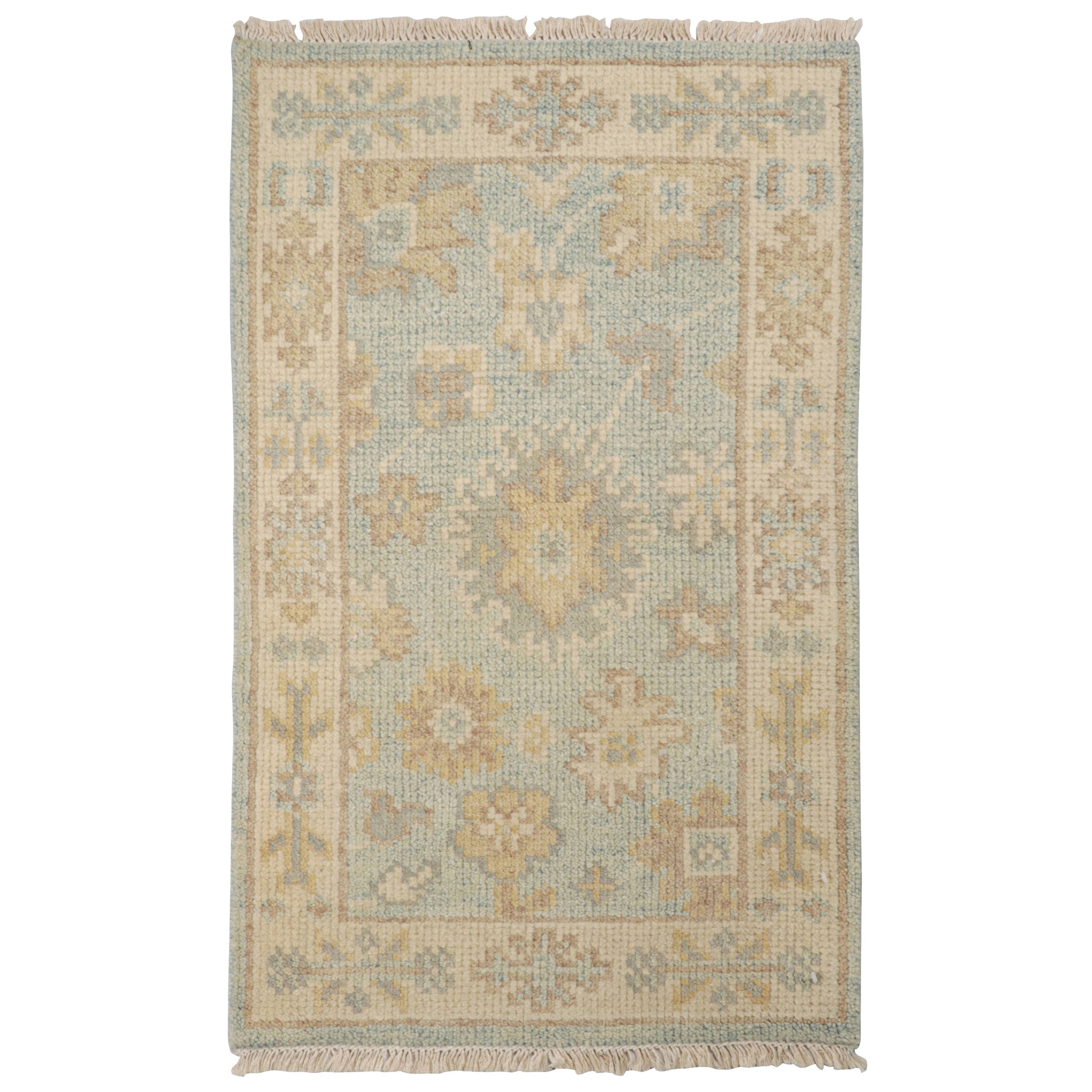 Rug & Kilim's Oushak Style Rug in Blue with Beige-Brown Floral Patterns (tapis de style Oushak en bleu avec des motifs floraux beige et marron) en vente