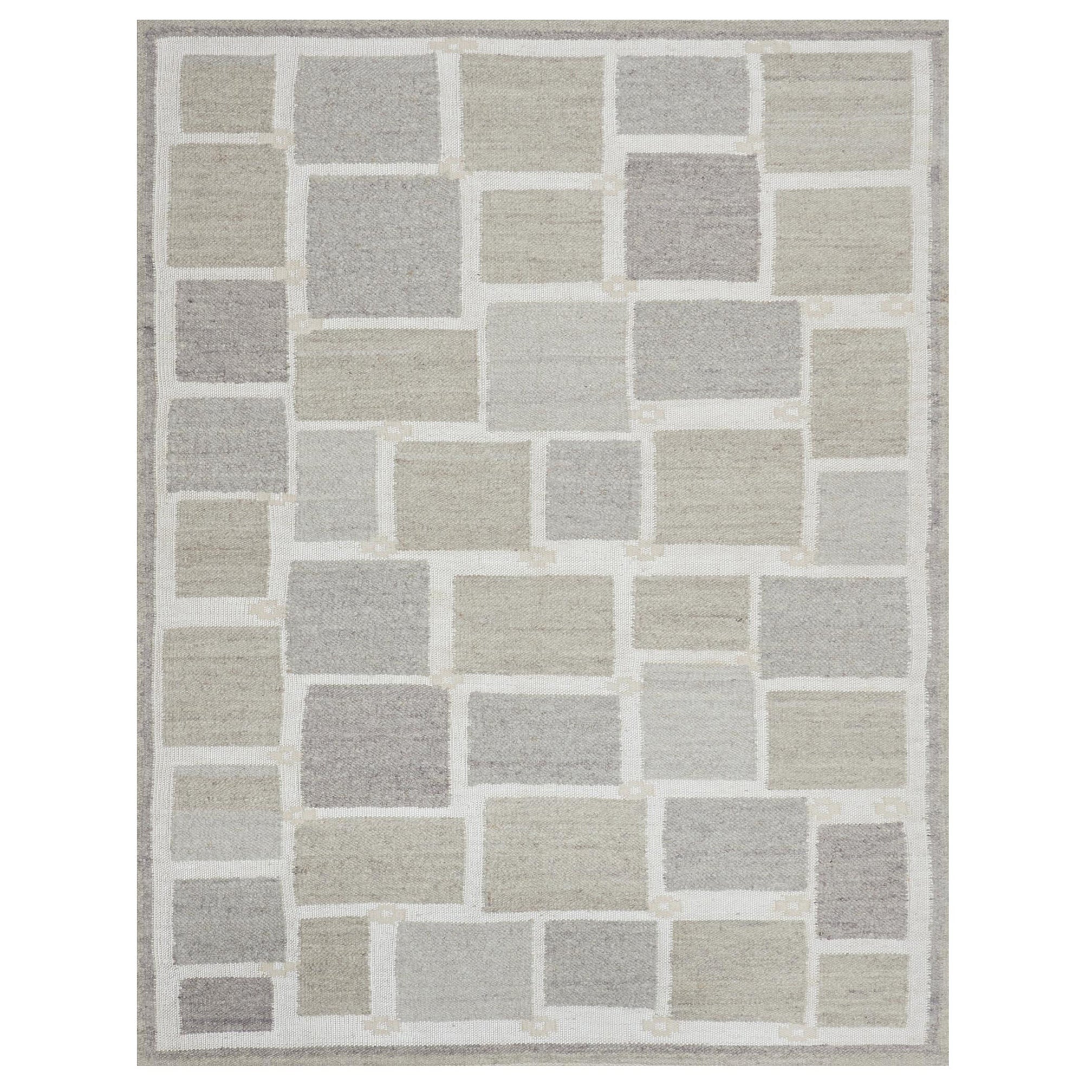 Tappeto contemporaneo in lana beige di ispirazione svedese realizzato a mano