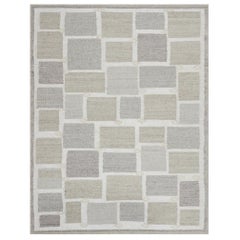Tappeto contemporaneo in lana beige di ispirazione svedese realizzato a mano