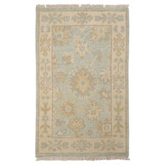 Rug & Kilim's Oushak Style Rug in Blue with Beige-Brown Floral Patterns (tapis de style Oushak en bleu avec des motifs floraux beige et marron)