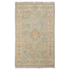 Rug & Kilim's Oushak Style Rug in Blue with Beige-Brown Floral Patterns (tapis de style Oushak en bleu avec des motifs floraux beige et marron)