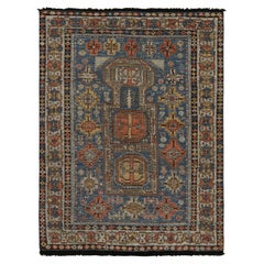 Rug & Kilim's Tribal Style Rug in Blue, with Red and Gold Geometric Patterns (tapis de style tribal en bleu, avec des motifs géométriques rouges et dorés)