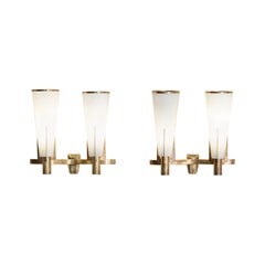 Pair of brass and opaline glass wall lamps by Stilnovo, Italy 1955
