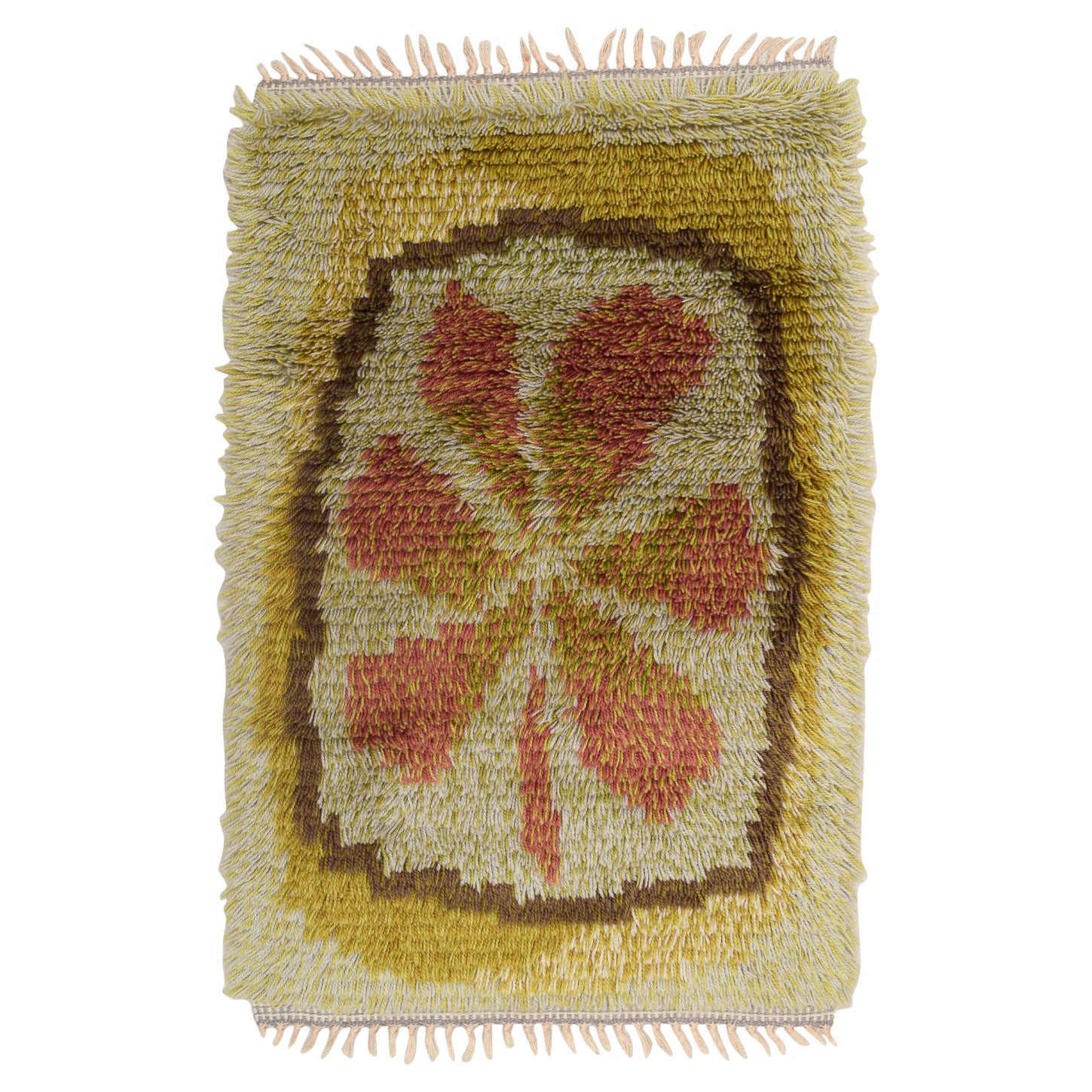Designer textile scandinave. Tapis en coton rya. Motif de feuilles aux couleurs de l'automne.