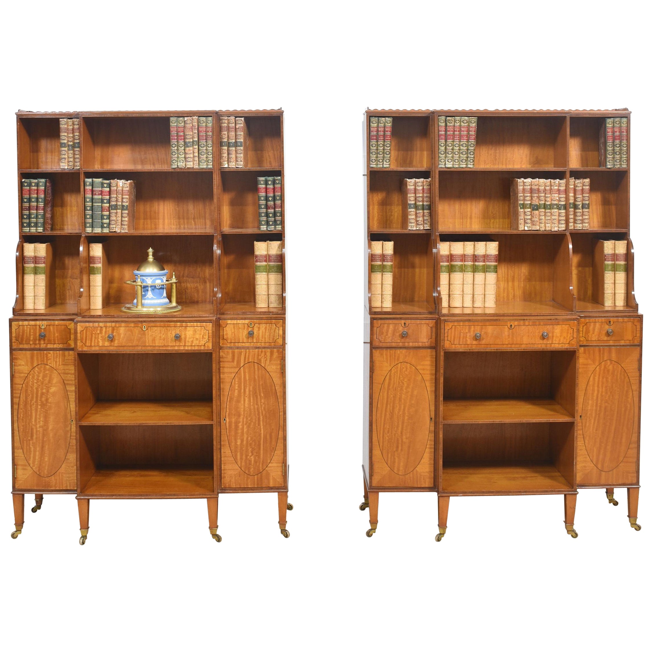 Pair of satinwood crossbanded open breakfront waterfall bookcases For Sale