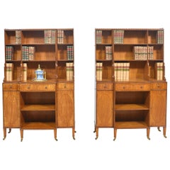 Pair of satinwood crossbanded open breakfront waterfall bookcases