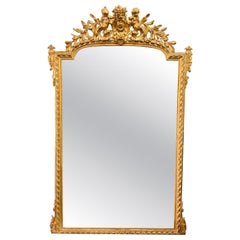 Specchio francese Luigi XVI del XIX secolo intagliato e in legno dorato