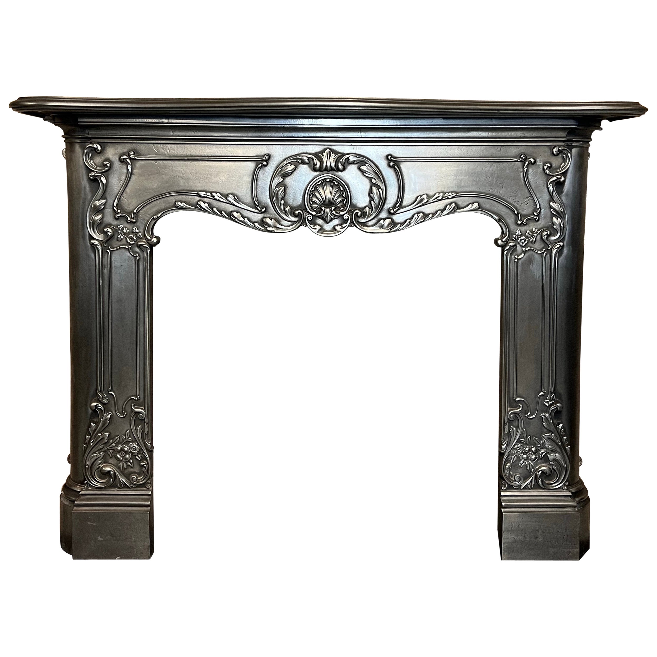 19th Century Cast Iron Serpentine Burnished Fireplace Mantlepiece For Sale