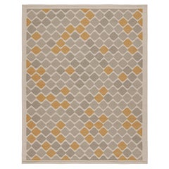 Tapis de style scandinave à motifs gris et or de Rug & Kilim