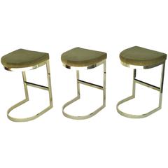 Set of Three Polished Brass and Pony Hide Barstools by Milo Baughman 