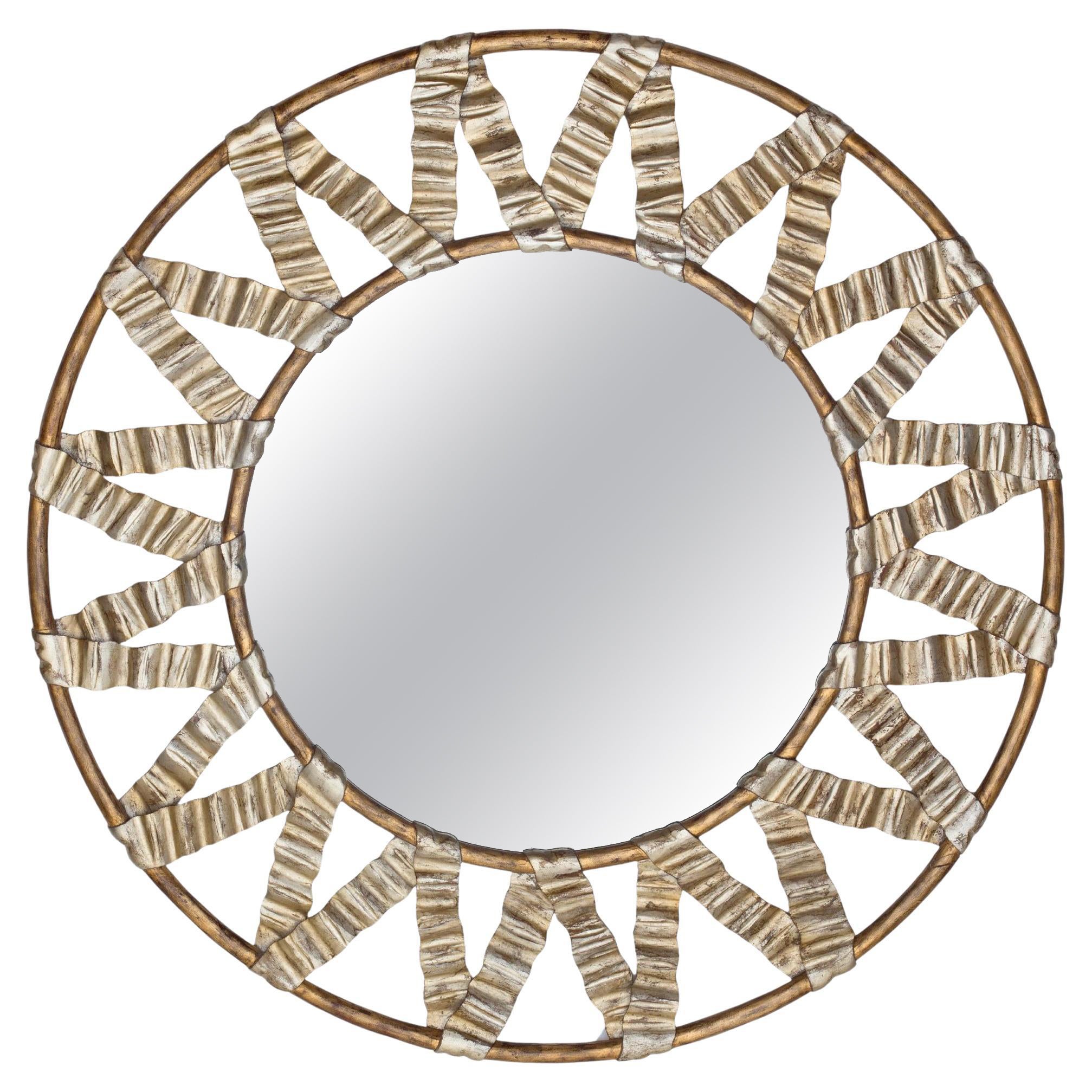 Round mirror with carved wooden frame with ribbons, C. Guy, Indonesia circa 1990 For Sale
