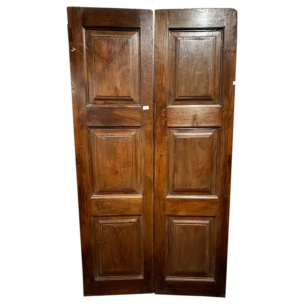 Antique door in walnut wood, two leaves with carved panels, Italy For Sale