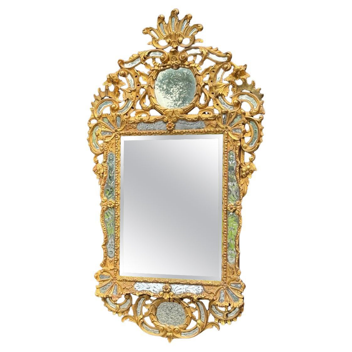 Louis XV style mirror with glazing beads in gilded wood, early 19th century For Sale