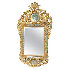 Louis XV style mirror with glazing beads in gilded wood, early 19th century
