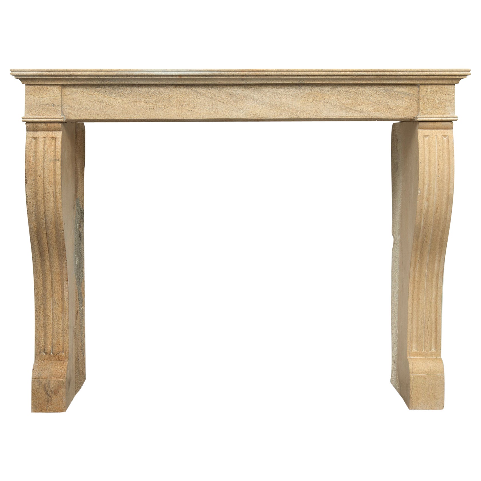 19th Century French Campagnard Limestone Fireplace with Sculpted Scroll Jambs For Sale