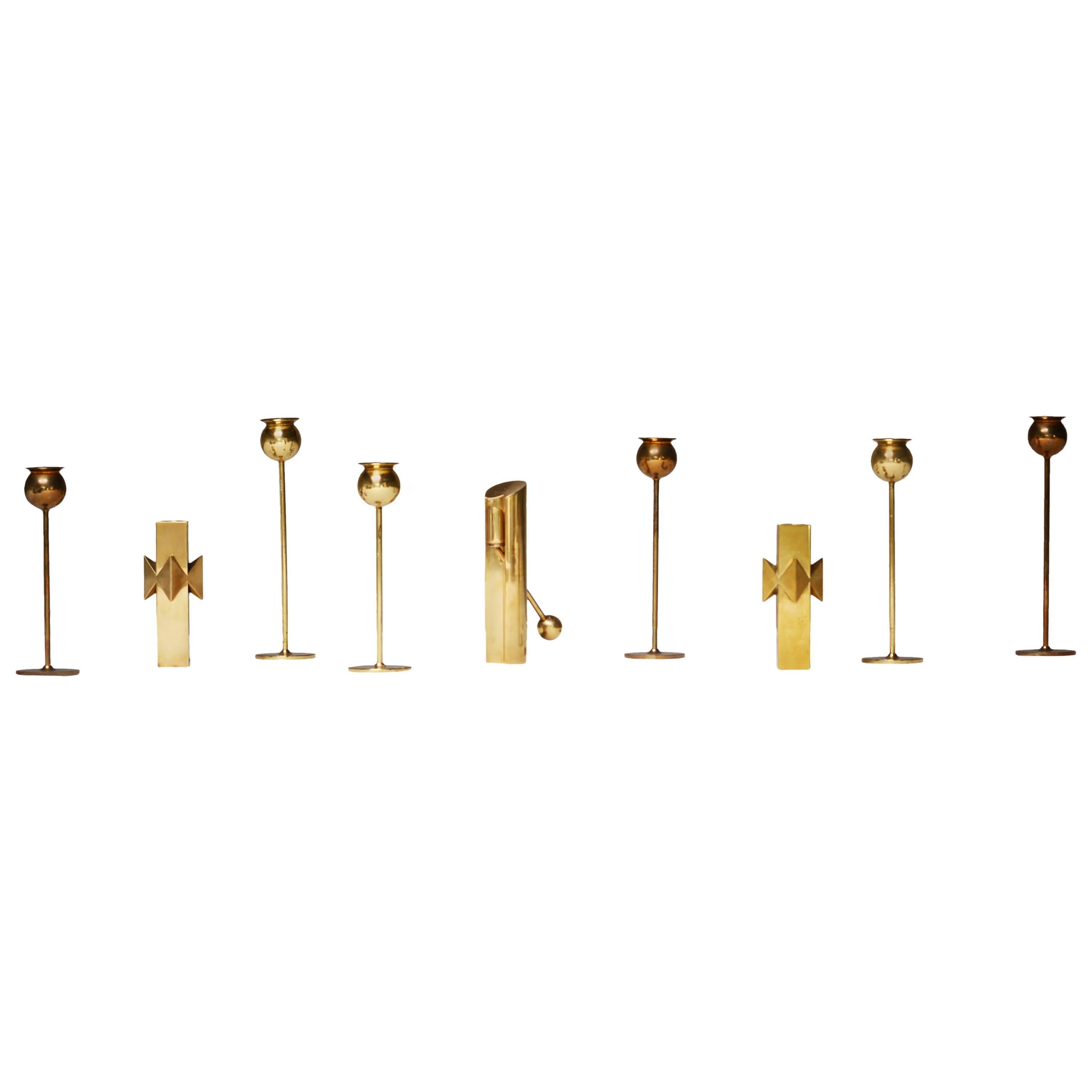 Pierre Forsell Rare Set of Nine Brass Candlesticks, Skultuna, Sweden For Sale