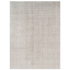 Tapis texturé surdimensionné de Rug & Kilim dans des tons beige et crème unis et des rayures