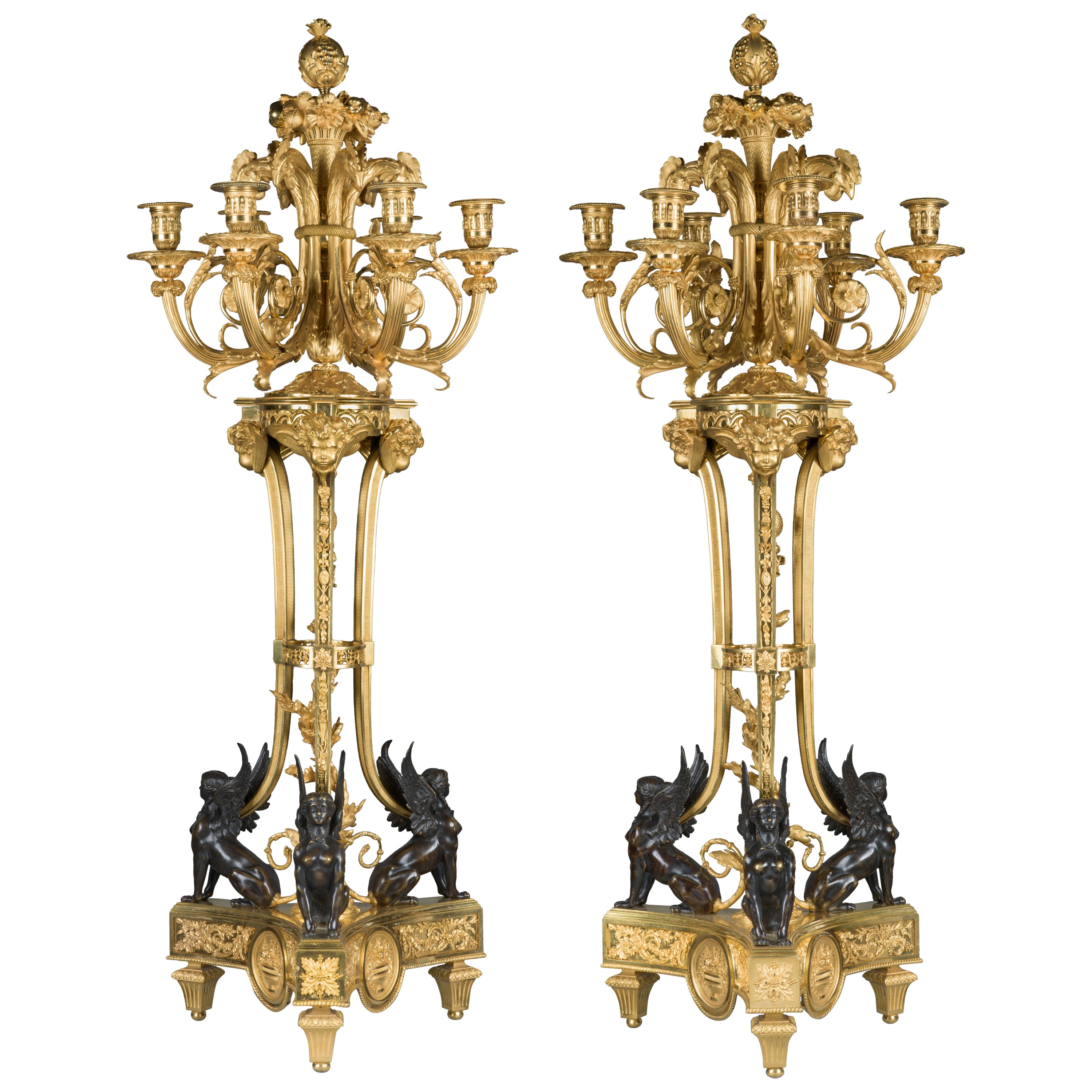 Pair of candlesticks. Bronze (blued and gilt). France, circa 1800. For Sale