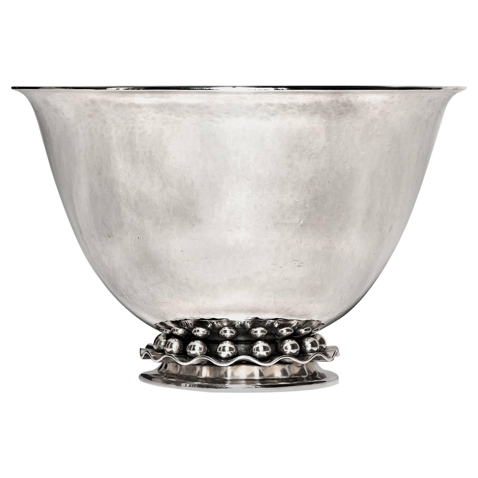 Circa 1950s, Sterling, Cohr, Denmark. This fabulous fifties sterling bowl by Cohr is a sophisticated example of mid-century Danish Modern. Its elegant simplicity is underscored by the visual serenity of the hammered finish and spotted by the