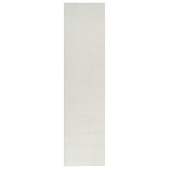 Rug & Kilim: un tappeto oversize dai toni semplici e solidi del bianco crema.