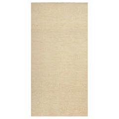Rug & Kilim's Zeitgenössischer, texturierter, solider Teppich in Beige