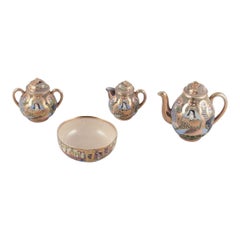 Satsuma, Japan. Egoist tea set consisting of a teapot, sugar bowl, creamer, cup.