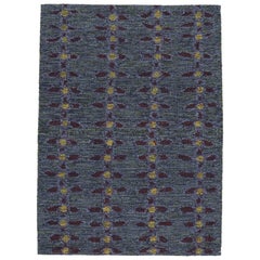 Rug & Kilim’s Scandinavian Rug in Indigo, with Red and Yellow Floral Patterns