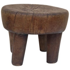 A brutalist low stool