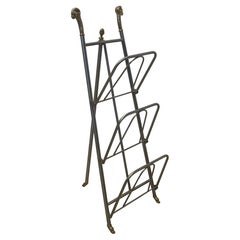 Portariviste in stile Maison Jansen in acciaio e ottone con testa e piedi a forma di trave, Italia