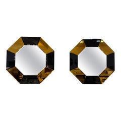 Pareja de espejos de pared octogonales italianos de cristal espejado negro y dorado