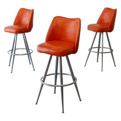 Mid-Century Modern Orange Vinyl & Chrome Swivel Bar Stools — Set of 3