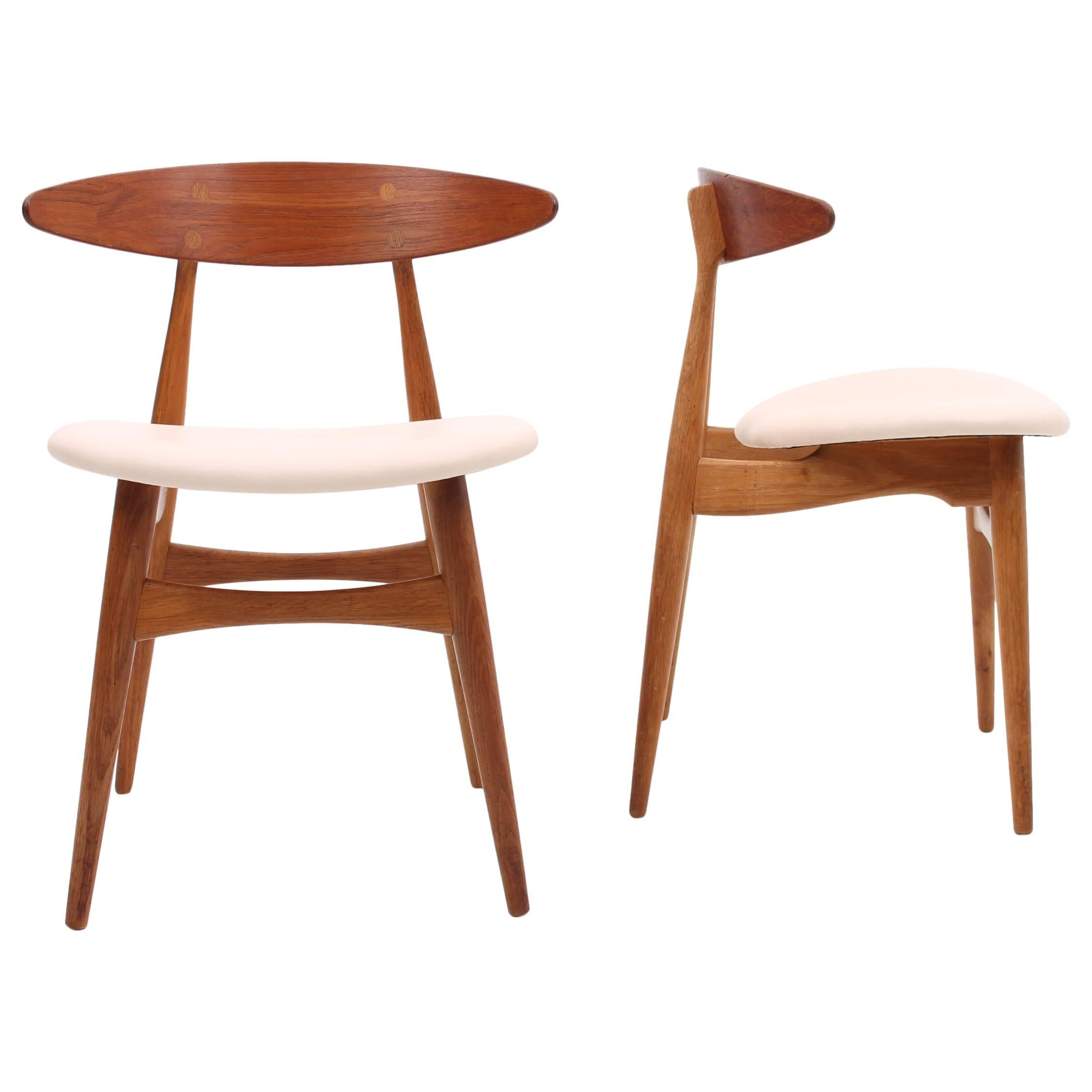 Set of Two Teak and Oak  CH33 Chairs by Hans J Wegner with Cream Leather