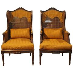 Pair of 19th Century French Caned Winged Armchairs in Walnut