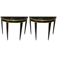 Pair of French 1940s-1950s Ebonized Demilune Consoles