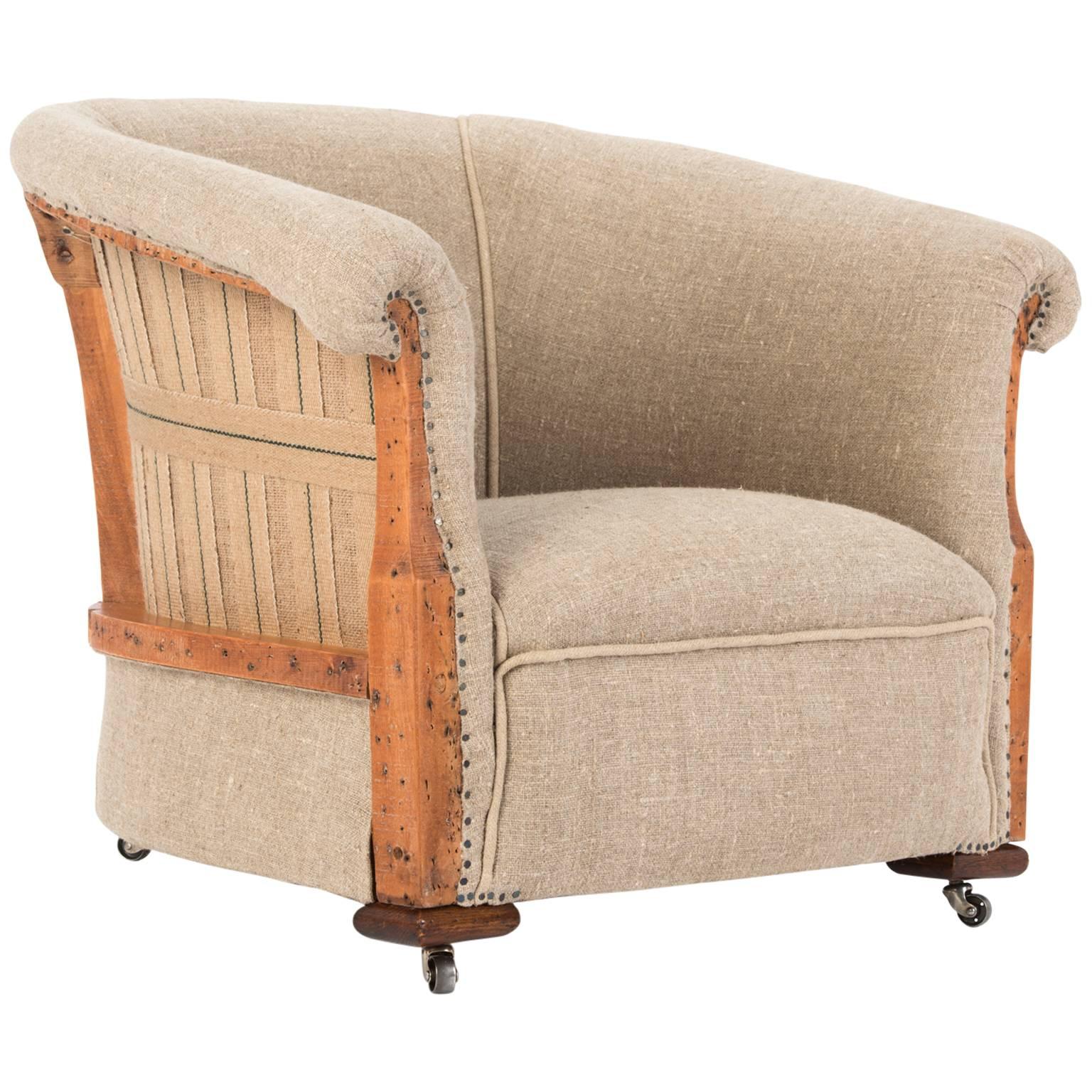 Unique and quirky original late Victorian tub chair traditionally restored and reupholstered in a classic organic flax linen with detailed exposed waxed frame, beautifully shaped revealed frame showing both traditional upholstery methods, webbing