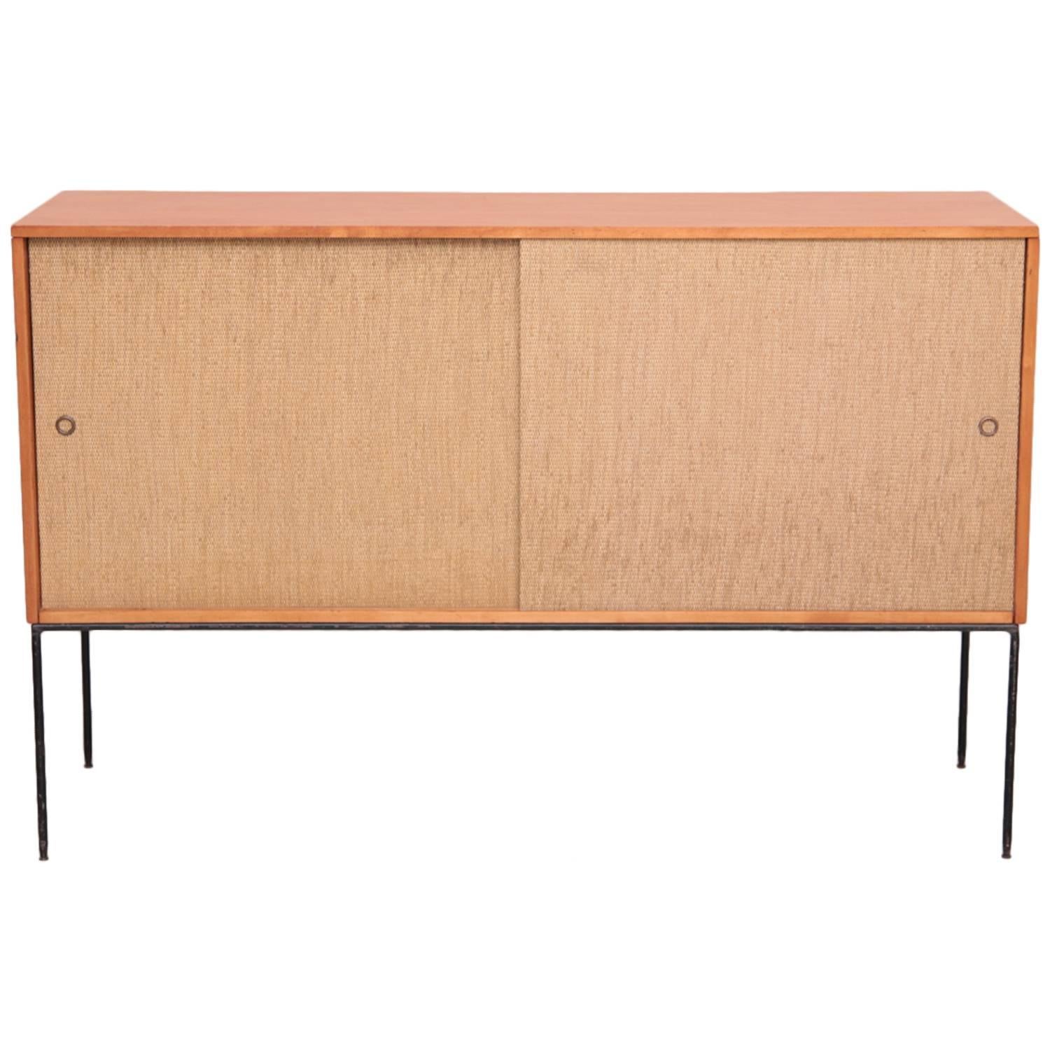 Stunning wrought iron base sideboard or credenza by Paul McCobb for Winchendon with sliding doors and drawers inside.

Excellent vintage condition!

