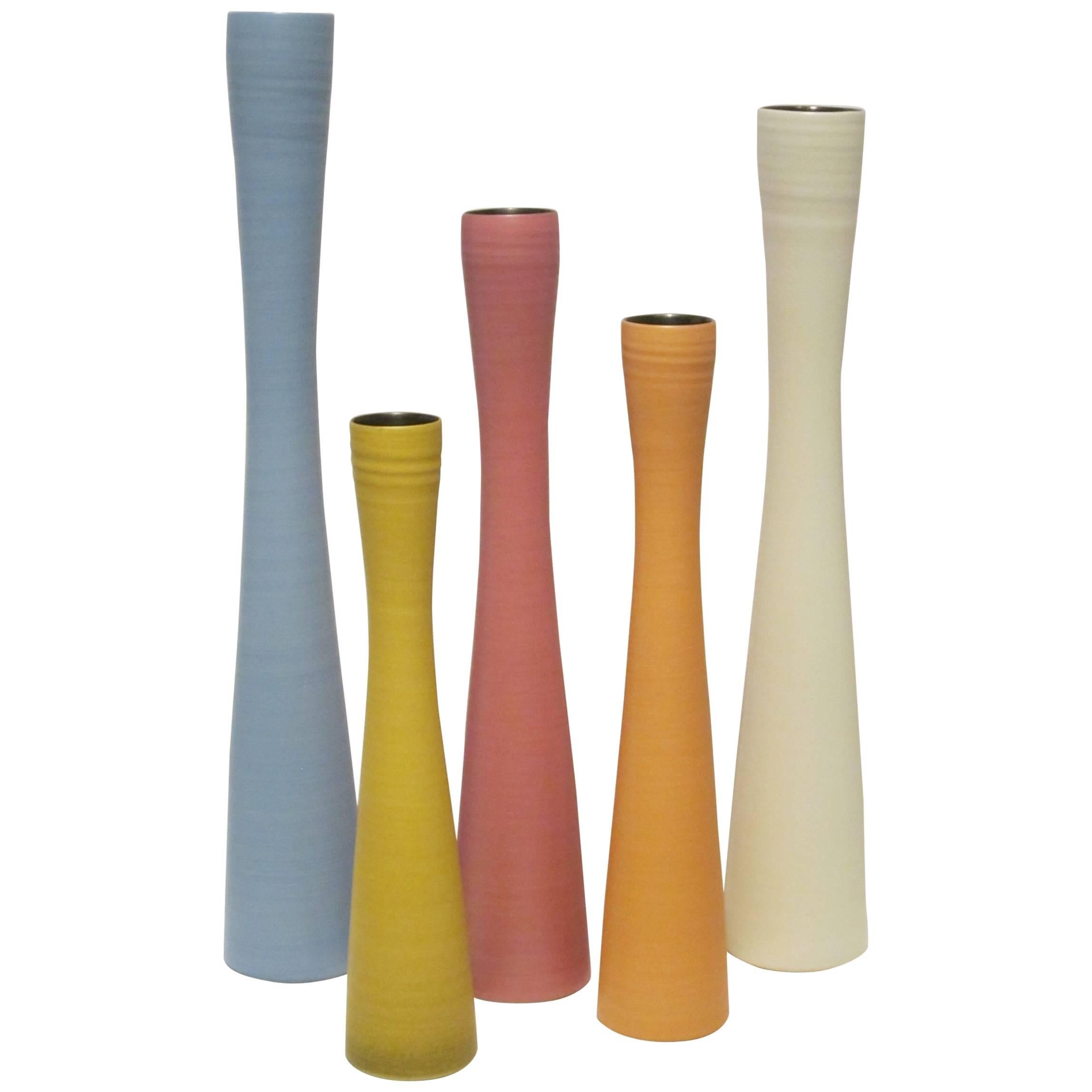 Contemporary Italian collection of hand made fine ceramic slender shaped vases in five different sizes.
Color assortment changes within each delivery.
Can be custom ordered by size and color.
Additional photo shows full range of sizes.
Photo of XS