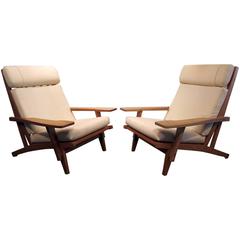 Pair of Danish Modern Lounge Chairs Designed by Hans Wegner with One Footstool