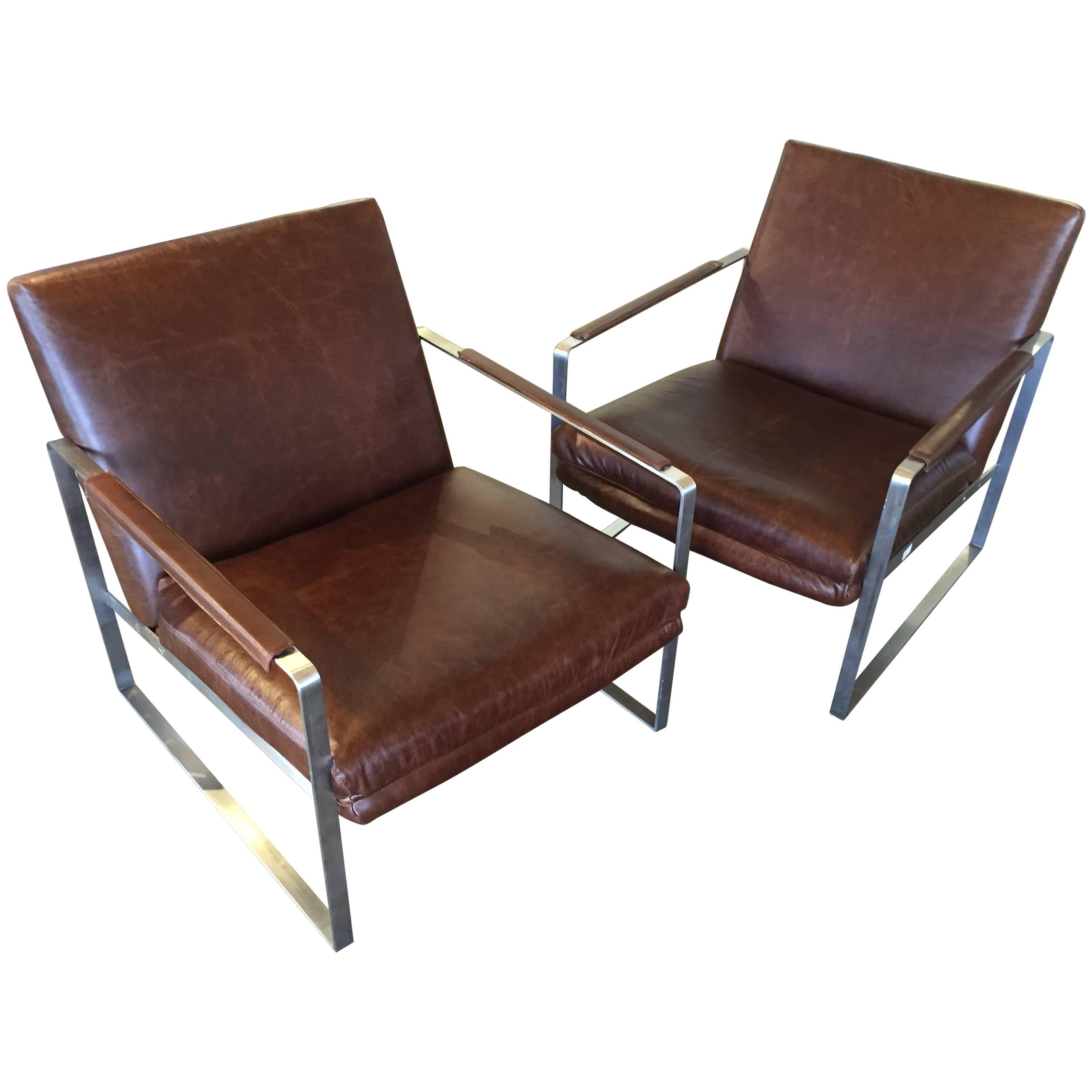 Brushes Steel and Distressed Leather Armchairs