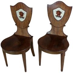 Antique Pair of George III Mahogany Hall Chairs with Painted Heraldic Backs