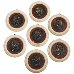Seven Italian Neoclassical Alabaster, Red Marble and Patinated Bronze Medallions