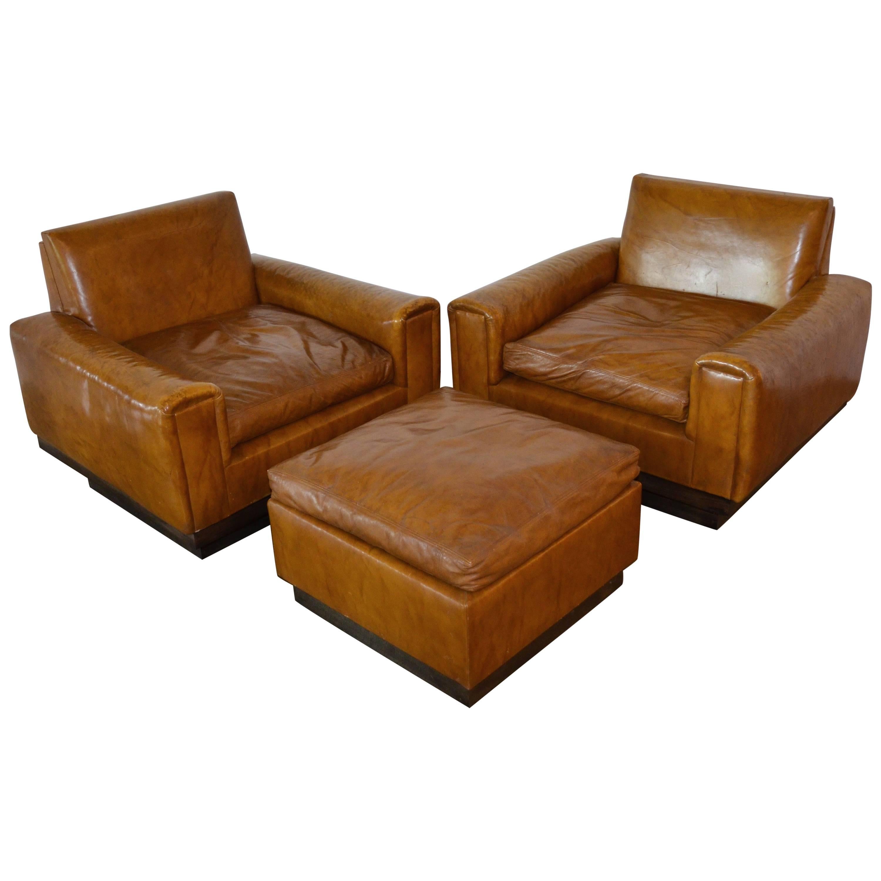 Mid-Century French Cognac Leather Club Chairs and Ottoman