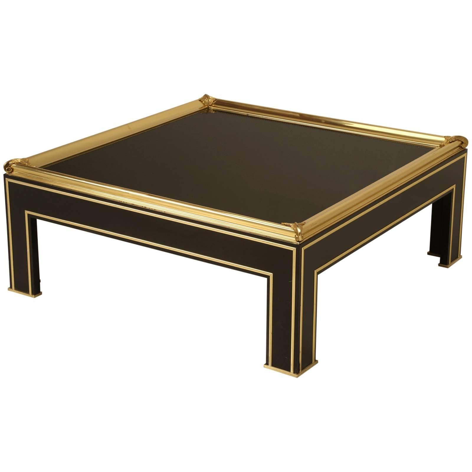 French Coffee Table Style of Maison Jansen Black Glass, Lacquer with Brass Trim For Sale