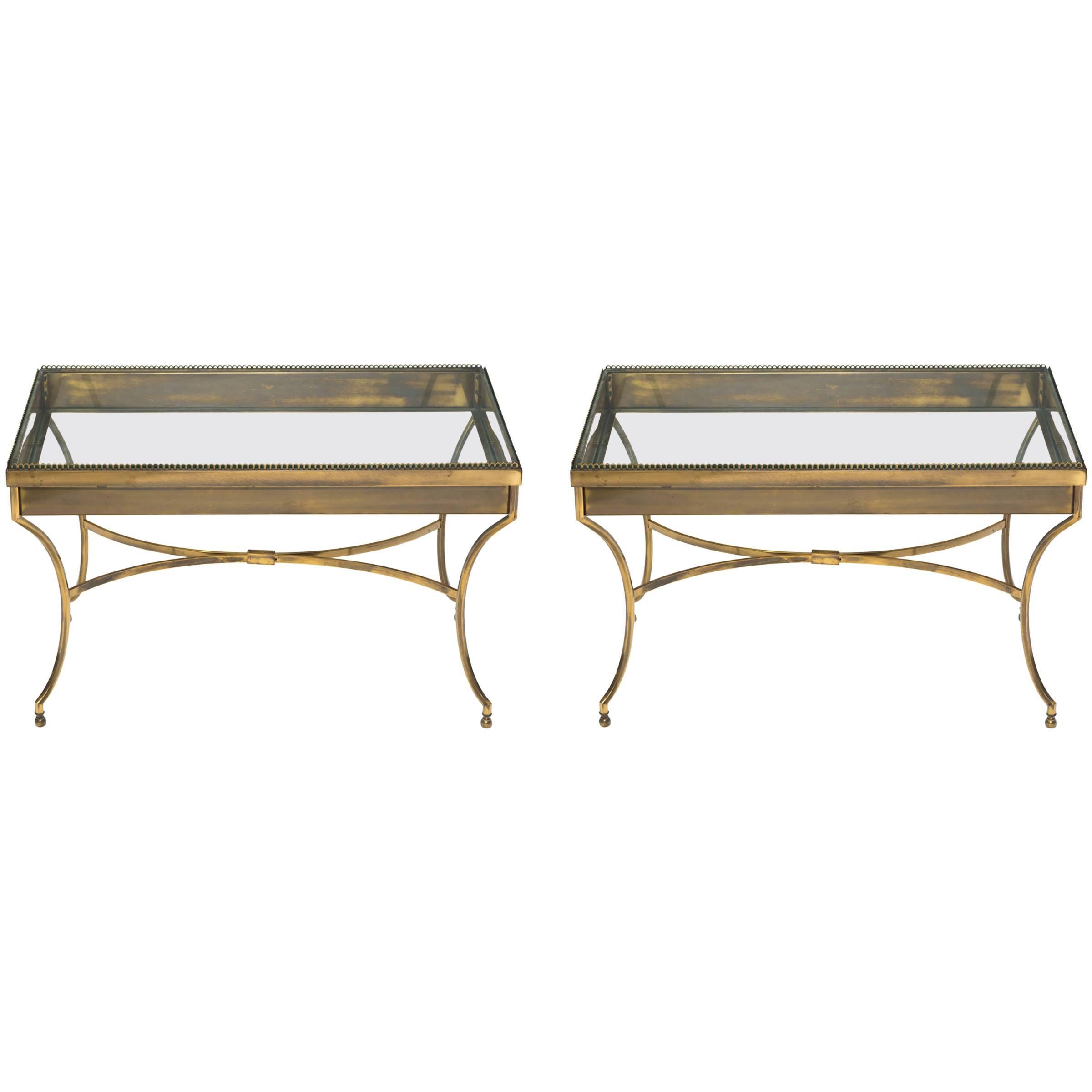 Solid brass display table. Glass top lifts off to display items. There is only one table left. You would be buying one table for the asking price of 1250.00.