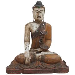 A large well Articulated Burmese Mandalay Buddha in Carved Polychromed Wood