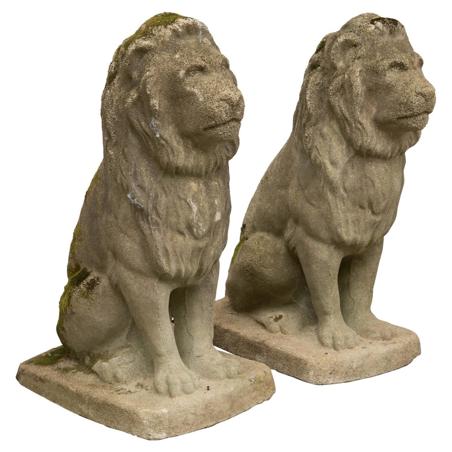 Pair of Modestly Scaled Vintage Cast Stone Seated Lion Statues For Sale