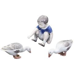 Set of Three Royal Copenhagen Porcelain Figurines "Boy Feeding Geese"