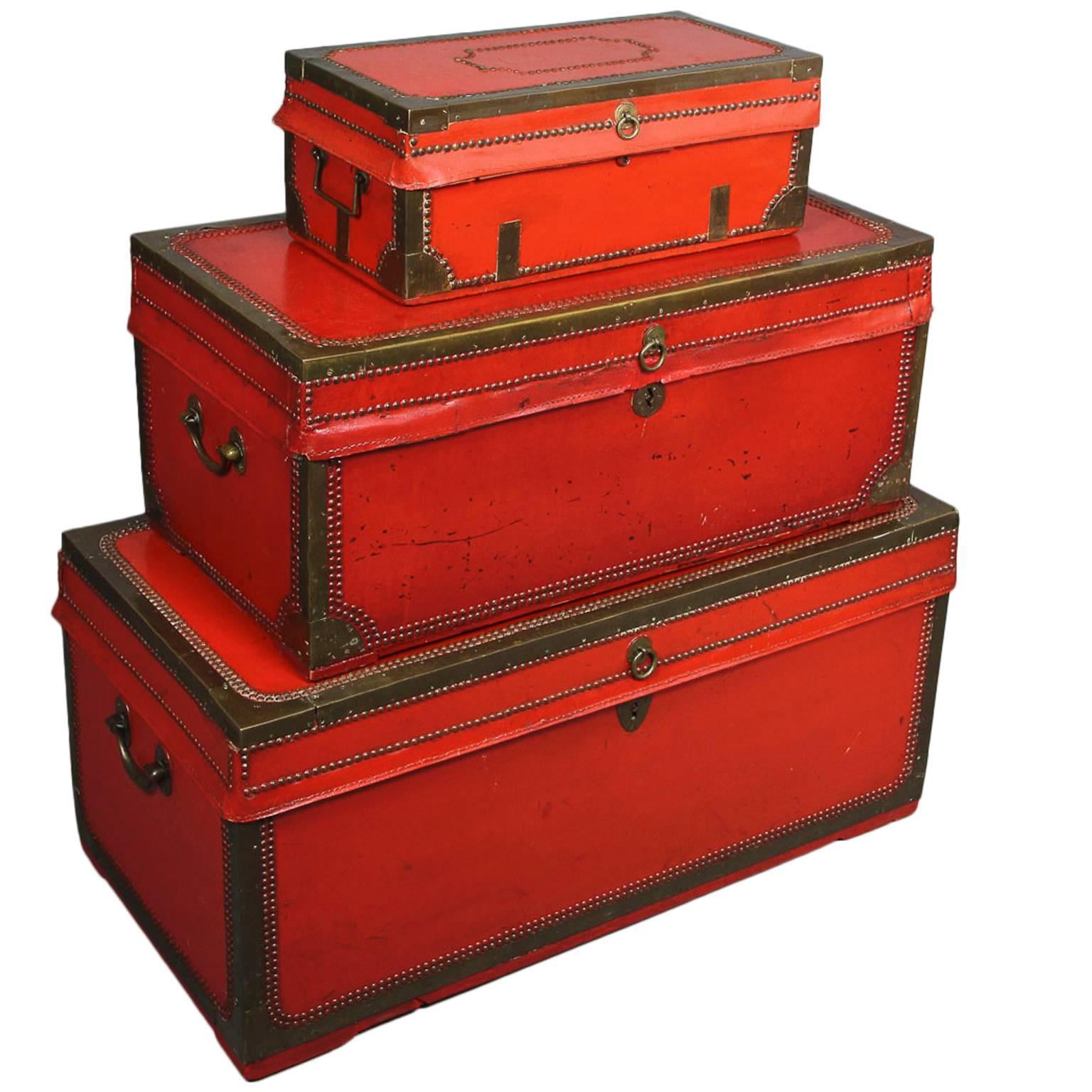 Nest of Three Chinese Export Red Lacquered Leather Trunks
