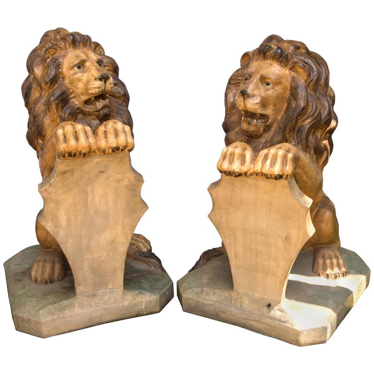 Pair Seated Cast Concrete Lions with Shields For Sale at 1stdibs